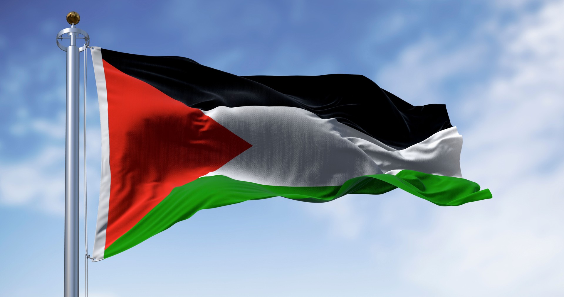 Palestine national flag waving on a clear day